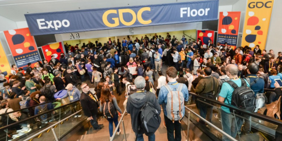 People riding the escalator at the Game Developers Conference